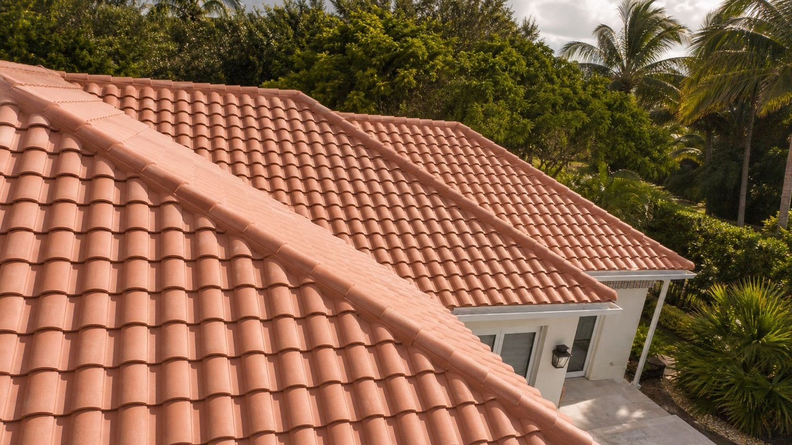 The same roof re-laid with sound barrel tile, straight courses and finished ridge caps